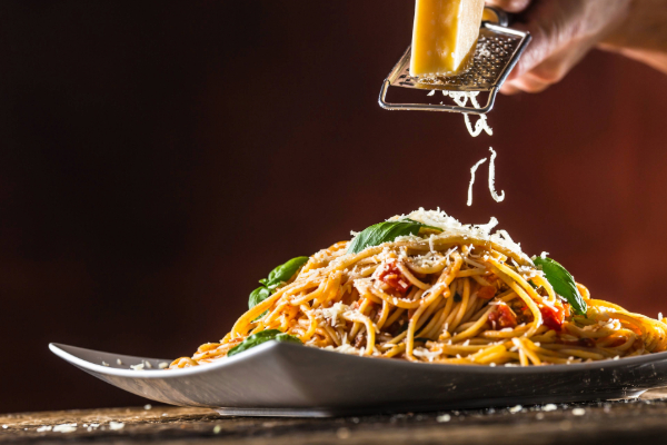 plate of pasta with grated cheese