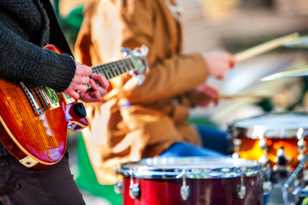 band playing instruments together outdoors