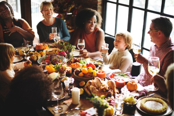 family gathered around the table for thanksgiving dinner