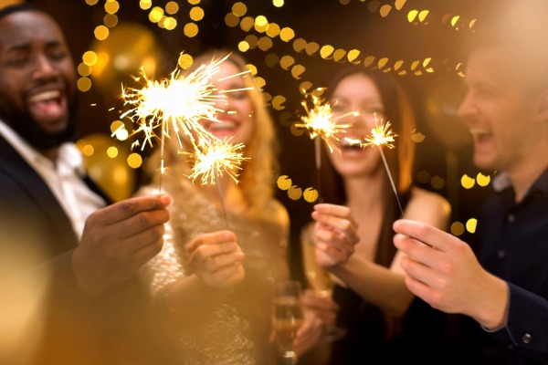 friends with sparklers in their hands